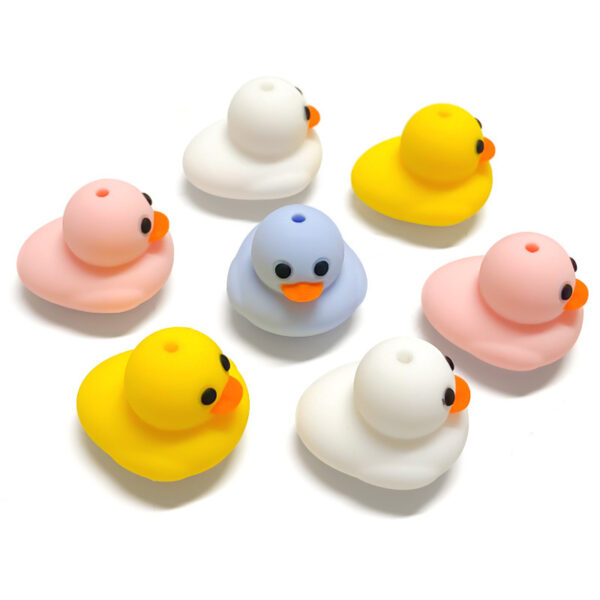 O1CN01jG0cvk1mHzger2TaX_2220494344930-0-cib Wholesale 3D Pure Color Little Yellow Duck Stereo Focal Beads