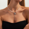O1CN01jXJh6Y23kFcMaoKxe_2588757293-0-cib Wholesale Black crystal ot-clasp heart-shaped tassel necklace