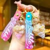 O1CN01jtu0sG1ahqhH8YlMu_2214301843362-0-cib Wholesale Colorful flowing sand seashell DIY insert oil keychain