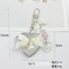O1CN01jy2p6220vkgVqznz2_2550186912-0-cib Wholesale Colorful Bow Love Mirror Metal Keychain