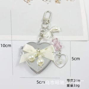 Large heart-shaped beige ribbon bow mirror