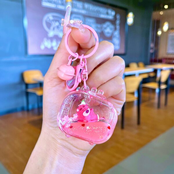 Wholesale Oil filled pink strawberry bear quicksand keychain