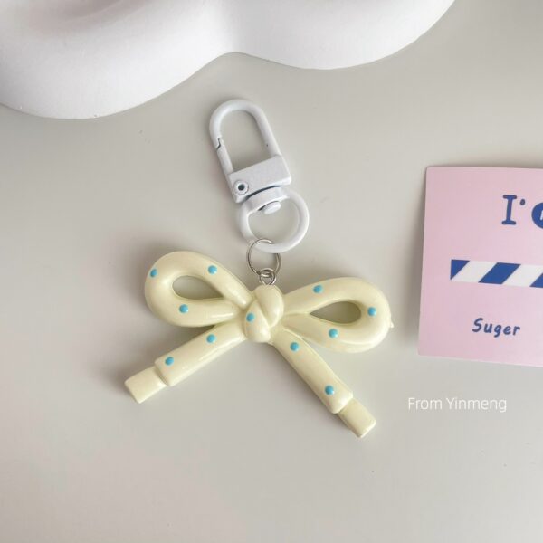 Wholesale spring and summer candy-colored hollow butterfly bow keychain