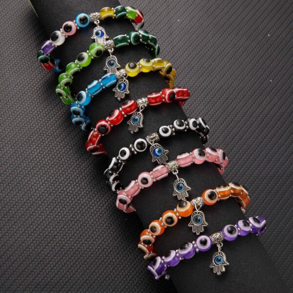 Wholesale alloy palm hollow blue eyes beaded pendant elastic bracelet Charms