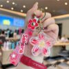 O1CN01lqgPeg1k48SQajFHh_2211846614629-0-cib Wholesale Acrylic Liquid Sand Plumeria Keychain
