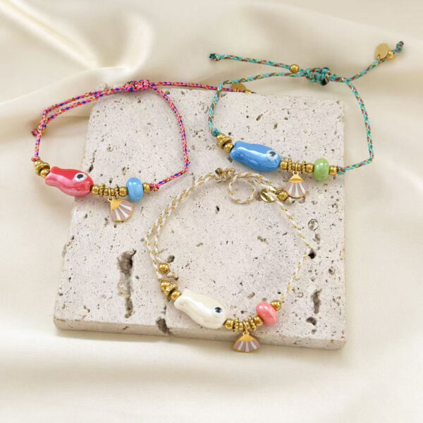 O1CN01mmD87u2DNwU3jqPOc_2216336188598-0-cib Wholesale Ocean Style Small Fish Ceramic Pendant Adjustable Titanium Steel Bracelets