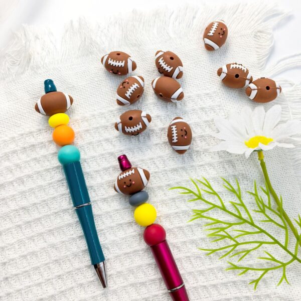 O1CN01nNC0mg2FO3hPop6E0_2216349148869-0-cib Wholesale 10pcs 3D Three-dimensional Silicone Cute Cartoon Rugby DIY Beads