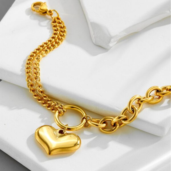 O1CN01nWnmeN258LyafWf9S_2218546207481-0-cib Wholesale Retro Love Golden Titanium Steel Bracelet
