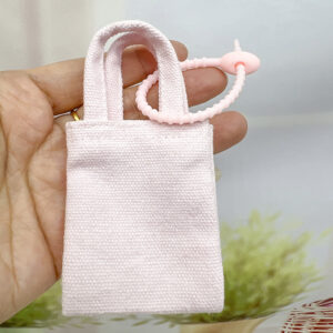Light pink corded cloth bag