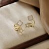 O1CN01o1q9JY1R49m2qG6T0_2220066242057-0-cib Wholesale Silver Needle Four Leaf Flower Micro inlaid Diamond Earrings