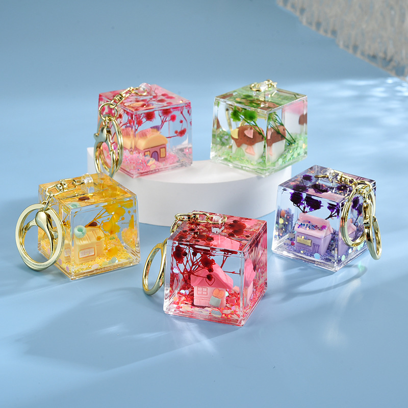Wholesale Acrylic flowing sand in oil bottle keychain