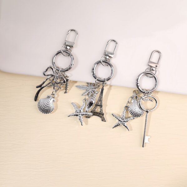 O1CN01qQpj5w1WtWK4VpQpR_2220577792846-0-cib Wholesale Creative Ocean Beach Tower Shell Metal Keychain