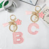 Wholesale Pink 26 letter Sparkling Pink Flower Tassel Keychain