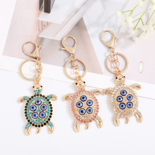 Wholesale Turtle shell with devil's eye inlaid with rhinestones Metal Keychain