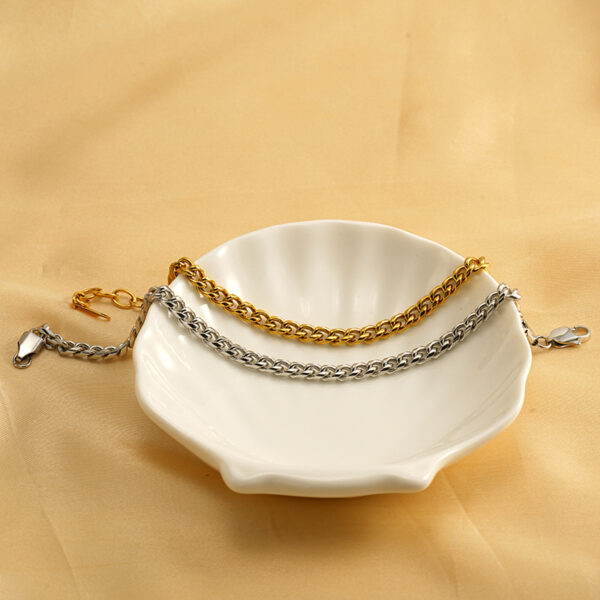 O1CN01scuPrQ2NGHvIFsPtd_2217889189935-0-cib Wholesale Titanium steel interlocking rings gold and silver bracelet