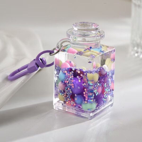 Wholesale Liquid sand bottle with colorful beads in oil bottle pendant acrylic keychain