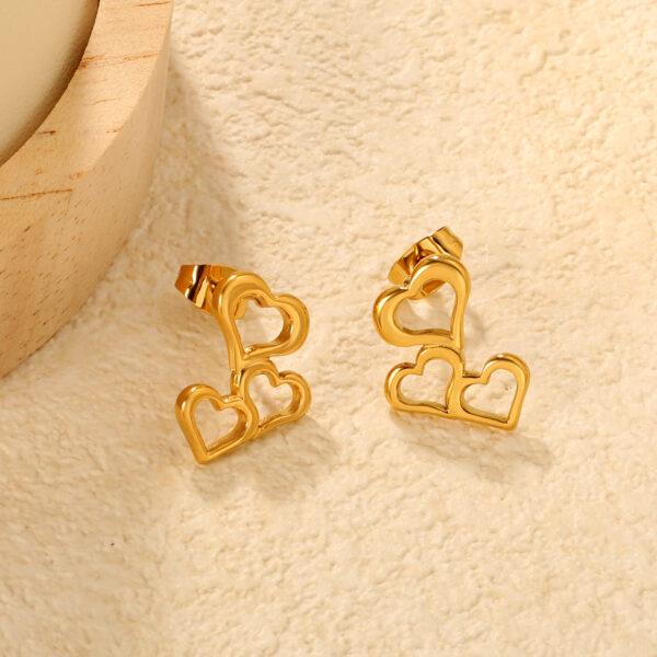 O1CN01trW0xb1V7bGl0DAGT_2214103262606-0-cib Wholesale 18k Gold-Plated Irregular Hollow Heart Earrings for Women