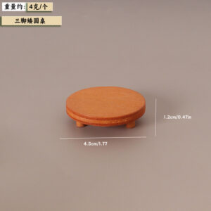 Three-legged low round table
