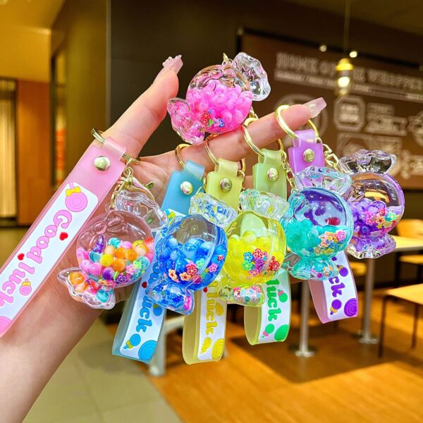 Wholesale Oil filled luminous colorful candy quicksand bottle keychain