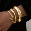 O1CN01w4fagH1lWouHTUlqx_2218670844827-0-cib Wholesale Golden wide edged wave band exaggerated bracelet