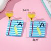 O1CN01w9kR7P2F776ggk94r_2217900038832-0-cib Wholesale Teacher's Day Pencil Printed Letter Love Acrylic Earrings