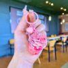 Wholesale Oil filled pink strawberry bear quicksand keychain