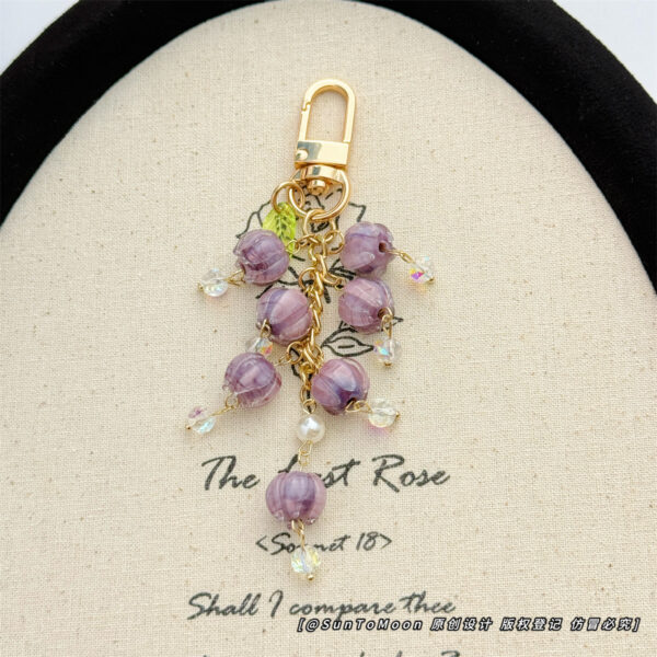 Wholesale Purple glazed bell orchid pearl chain keychain