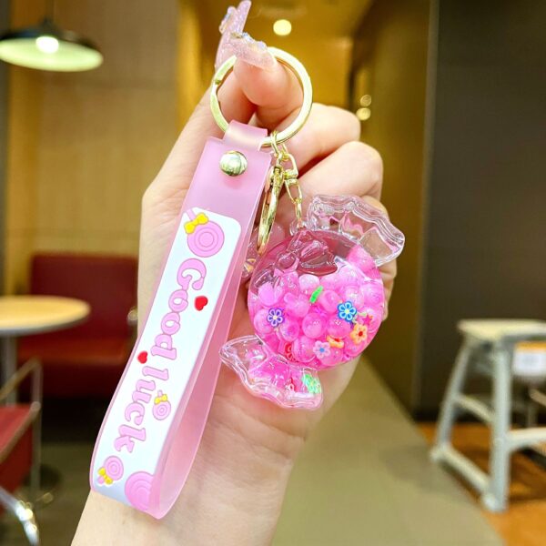 Wholesale Oil filled luminous colorful candy quicksand bottle keychain