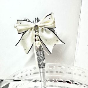 A finished pen with silver bow