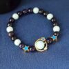 O1CN01xvwKPU2IVKnQAchWu_3919529291-0-cib Wholesale Obsidian, gold sandstone, and noctilucent fluorite bracelet