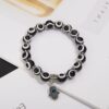 Wholesale alloy palm hollow blue eyes beaded pendant elastic bracelet Charms