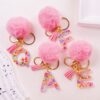 Wholesale Hairball English 26 letter pink keychain