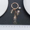 O1CN01yonbWl2Kpbd2trytU_2217654629606-0-cib Wholesale Cross-border oil-dripping black princess dress model small fragrant style hat high heels keychain exquisite jewelry key chain