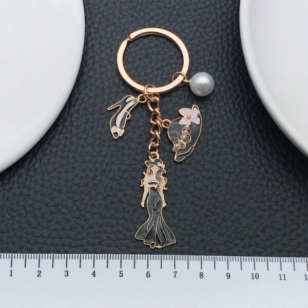 O1CN01yonbWl2Kpbd2trytU_2217654629606-0-cib Wholesale Cross-border oil-dripping black princess dress model small fragrant style hat high heels keychain exquisite jewelry key chain