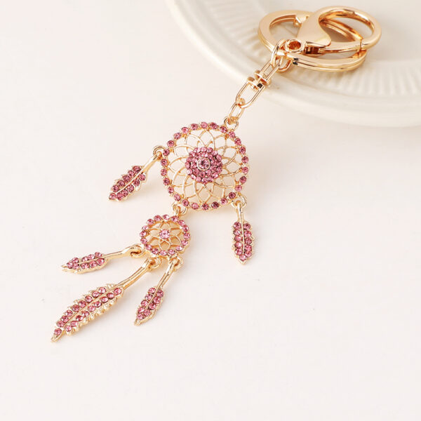 O1CN01zQ8S7a2A5DMpvANyx_1874418151-0-cib Wholesale Rose gold rhinestone tassel feather dreamcatcher design keychain