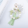 Wholesale Colored bead cross silicone bead tassel keychain