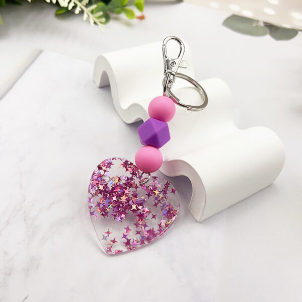 oly-01ef3eb675e842a720a53671de33ee92 Wholesale Magic Acrylic Love Silicone Beaded Keychain Bag Key Pendant