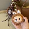 Wholesale Plush Big Head High-End Labubu School Bag Pendant Vinyl Doll Doll Pendant Car Keychain Wholesale Small Gifts