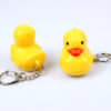 Wholesale In stock cute cartoon duck car keychain LED luminous sound creative electronic toy small gift bag ornaments