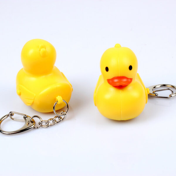 Wholesale In stock cute cartoon duck car keychain LED luminous sound creative electronic toy small gift bag ornaments