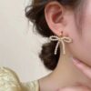 Wholesale Lady Style Bow Pearl Earrings 2024 New Style Gentle Girl Ear Buckle French Retro Earrings High Earrings
