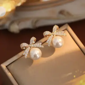 63-Gold Bow Pearl Earrings