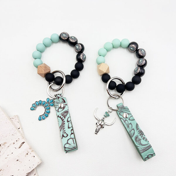 Wholesale Western cowboy style beaded green leather alloy keychain