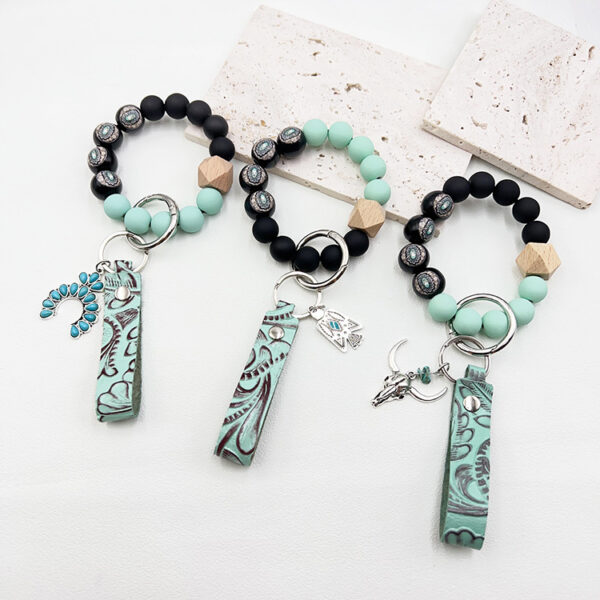 Wholesale Western cowboy style beaded green leather alloy keychain