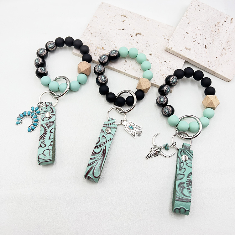 Wholesale Western cowboy style beaded green leather alloy keychain