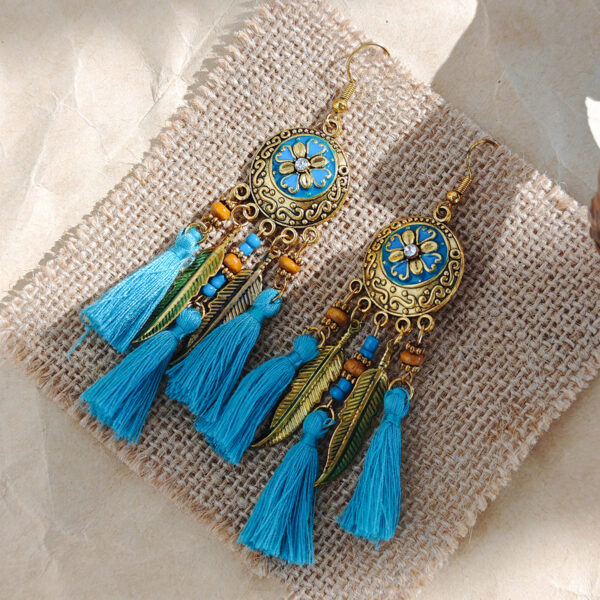 oly-0eea05fde5aa9c73a6120c86ca7ab5b4 Wholesale Bohemian Color Feather Clip Fabric Tassel Rice Bead Earrings Retro Ethnic High-end Hollow Earrings