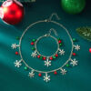 Wholesale New European and American cross-border Christmas jewelry set for women, featuring colorful bells, rhinestone-encrusted snowflakes, and pendants.