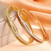 Wholesale Geometric Bangle For Women In Golden Titanium Steel With Electroplated Finish And Rhinestone Inlay