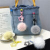 Wholesale Creative cute fur ball small flower key chain small fresh color candy ball plush bag pendant earphone set accessories