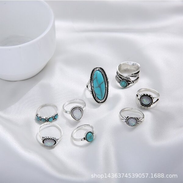 Wholesale Europe and the United States hot cross-border retro inlaid turquoise carved feather ring 8 suit ring jewelry factory direct sales